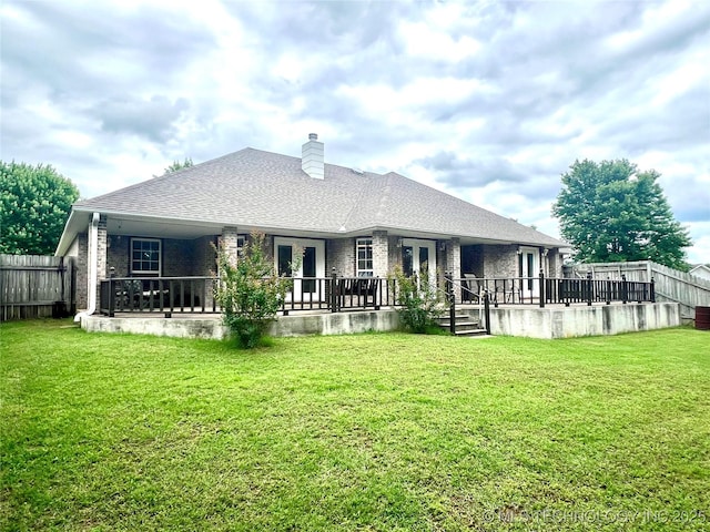 1403 NW Mimosa Cir, Stigler, OK 74462 - back of property with french doors, a chimney, and brick siding
