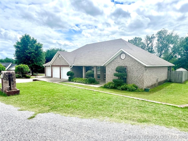 1403 NW Mimosa Cir, Stigler, OK 74462 - ranch-style home with an attached garage, brick siding, and driveway