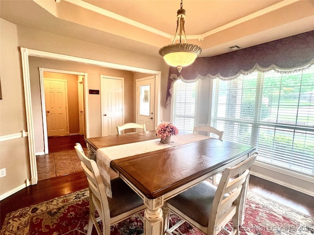 1403 NW Mimosa Cir, Stigler, OK 74462 - dining space with dark wood-style floors, ornamental molding, and baseboards