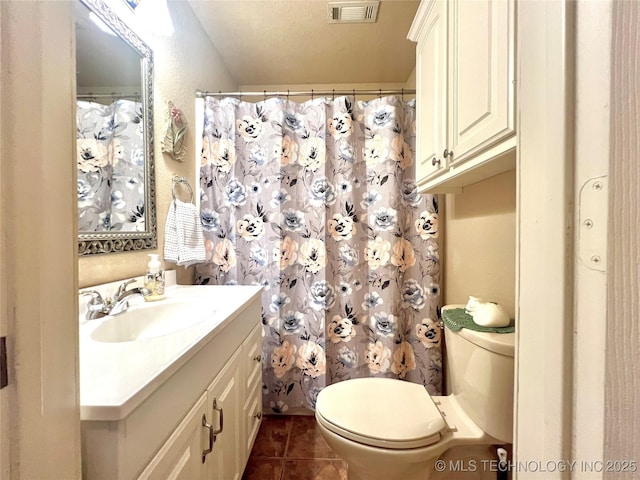 1403 NW Mimosa Cir, Stigler, OK 74462 - full bathroom featuring vanity, toilet, and tile patterned floors