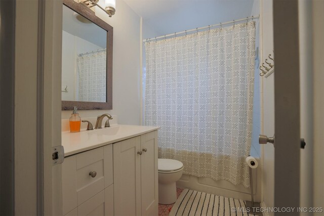 4524 E 45th St, Tulsa, OK 74135 - full bathroom with vanity, toilet, shower / bath combination with curtain, and tile patterned flooring