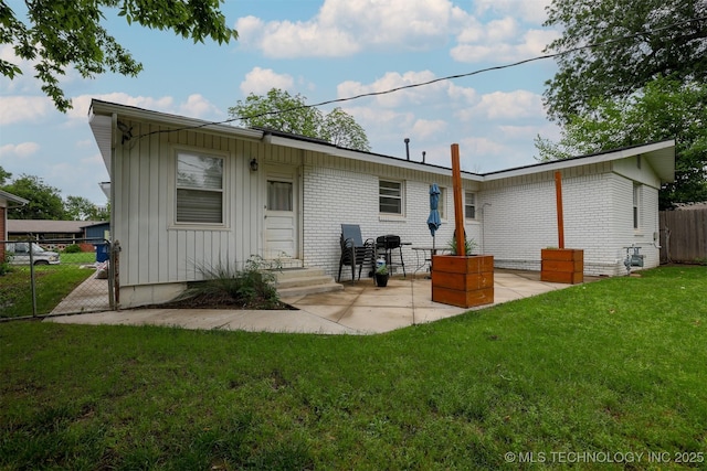 4524 E 45th St, Tulsa, OK 74135 - back of property with board and batten siding and a patio area