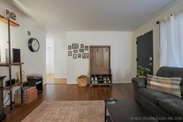 4524 E 45th St, Tulsa, OK 74135 - living room featuring wood finished floors, ornamental molding, and baseboards