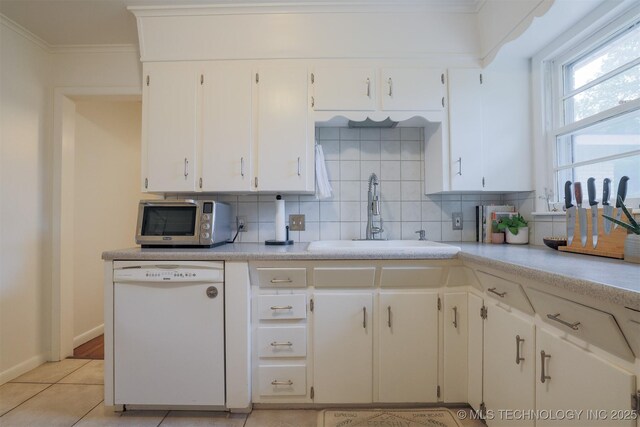 4524 E 45th St, Tulsa, OK 74135 - kitchen with dishwasher, a sink, stainless steel microwave, backsplash, and ornamental molding