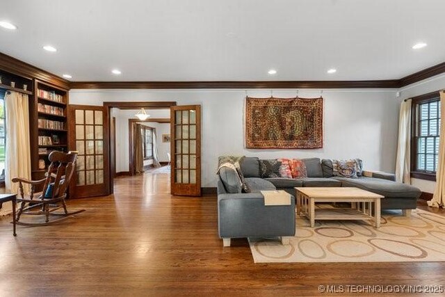 1701 S Rockford Ave, Tulsa, OK 74120 - living area with ornamental molding, french doors, wood finished floors, recessed lighting, and baseboards
