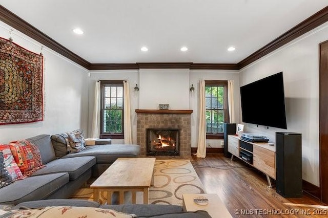 1701 S Rockford Ave, Tulsa, OK 74120 - living room with ornamental molding, a fireplace, wood finished floors, and recessed lighting