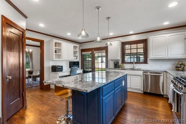 1701 S Rockford Ave, Tulsa, OK 74120 - kitchen with appliances with stainless steel finishes, ornamental molding, blue cabinets, white cabinetry, and light stone counters