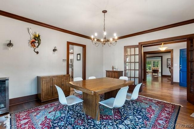 1701 S Rockford Ave, Tulsa, OK 74120 - dining space featuring wood finished floors, ornamental molding, a chandelier, french doors, and wine cooler