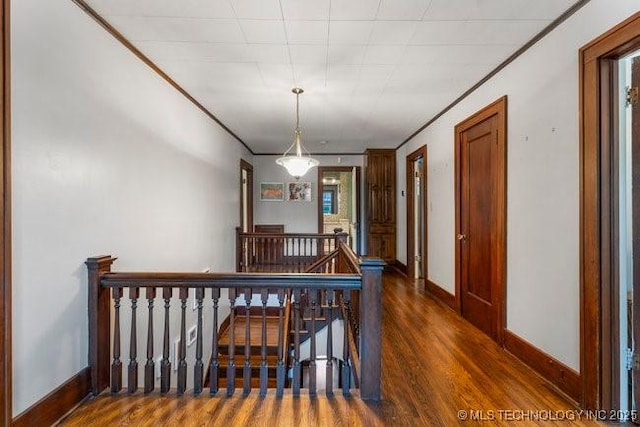 1701 S Rockford Ave, Tulsa, OK 74120 - hall featuring an upstairs landing, wood finished floors, and baseboards