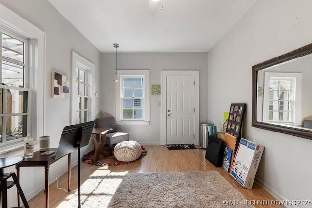1701 S Rockford Ave, Tulsa, OK 74120 - entryway with healthy amount of natural light, wood finished floors, and baseboards