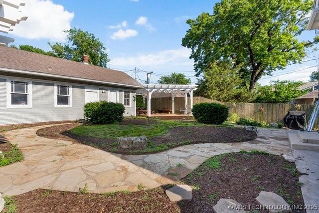 1701 S Rockford Ave, Tulsa, OK 74120 - view of yard featuring a pergola and a patio area