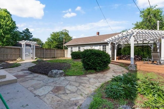 1701 S Rockford Ave, Tulsa, OK 74120 - view of yard featuring a pergola, a gate, and a deck