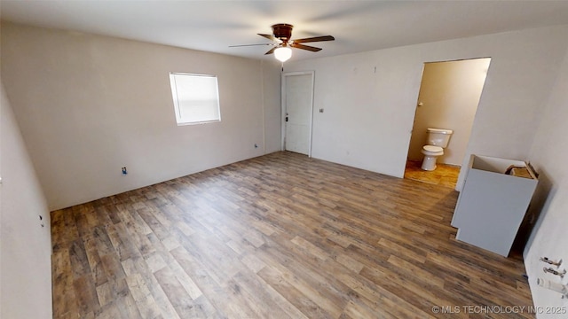 spare room featuring ceiling fan and wood finished floors