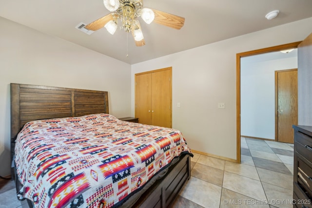 750 Spavinaw Hudson Pt, Spavinaw, OK 74366 - bedroom featuring light tile patterned flooring, a ceiling fan, a closet, and baseboards