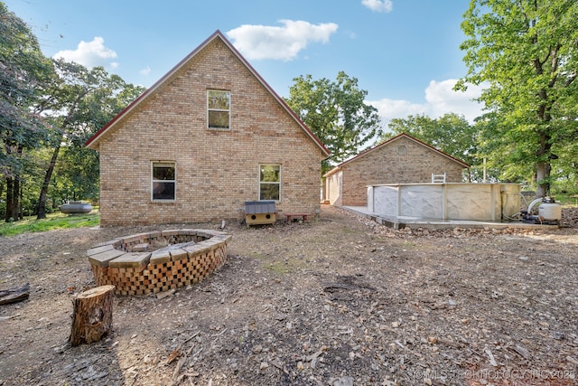 750 Spavinaw Hudson Pt, Spavinaw, OK 74366 - back of property with brick siding and central air condition unit