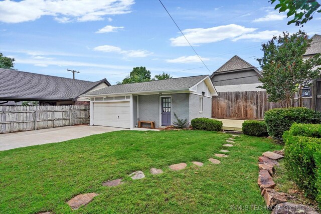 1241 E 29th St, Tulsa, OK 74114 - view of front of property featuring brick siding, concrete driveway, an attached garage, and roof with shingles