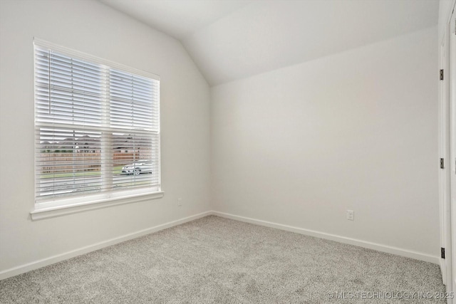 6512 N 27th St, Broken Arrow, OK 74014 - carpeted spare room featuring lofted ceiling and baseboards