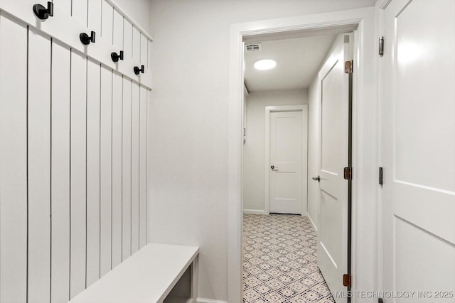 6512 N 27th St, Broken Arrow, OK 74014 - mudroom featuring baseboards and light floors