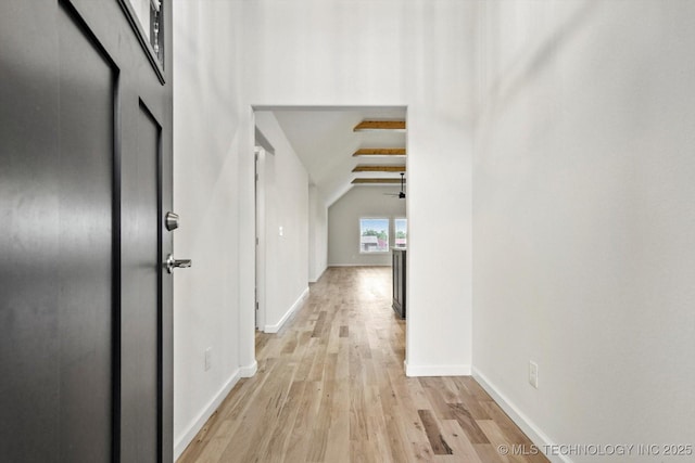 6512 N 27th St, Broken Arrow, OK 74014 - hall featuring light wood finished floors, vaulted ceiling, and baseboards