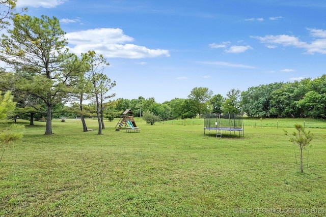 14355 N Trenton Ave, Skiatook, OK 74070 - view of green lawn with a playground and a trampoline