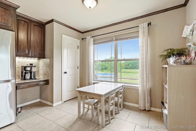 14355 N Trenton Ave, Skiatook, OK 74070 - dining area with crown molding and light tile patterned floors