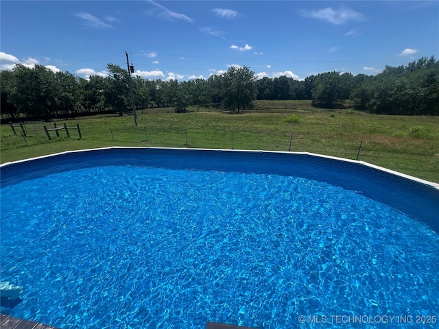 14355 N Trenton Ave, Skiatook, OK 74070 - swimming pool with a lawn and a view of rural / pastoral area