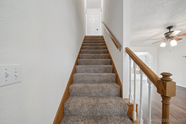 9227 S 95th E Ave, Tulsa, OK 74133 - staircase featuring wood finished floors, a ceiling fan, and a textured ceiling