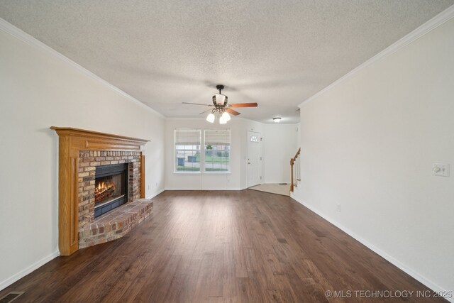 9227 S 95th E Ave, Tulsa, OK 74133 - unfurnished living room featuring a fireplace, a ceiling fan, dark wood-type flooring, stairway, and a textured ceiling