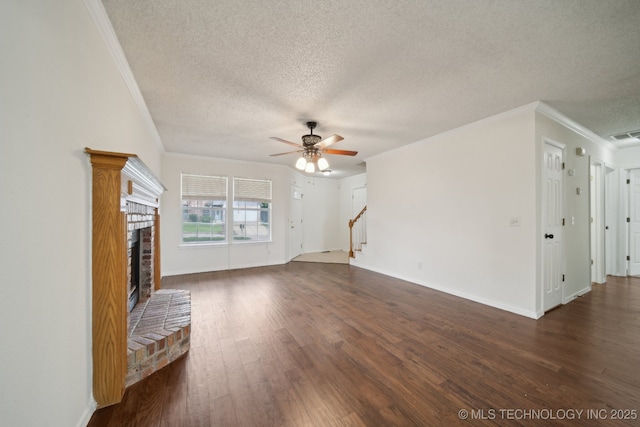 9227 S 95th E Ave, Tulsa, OK 74133 - unfurnished living room with a textured ceiling, a fireplace, ornamental molding, ceiling fan, and stairway