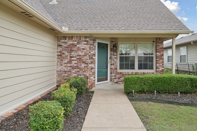 9227 S 95th E Ave, Tulsa, OK 74133 - property entrance featuring roof with shingles and brick siding