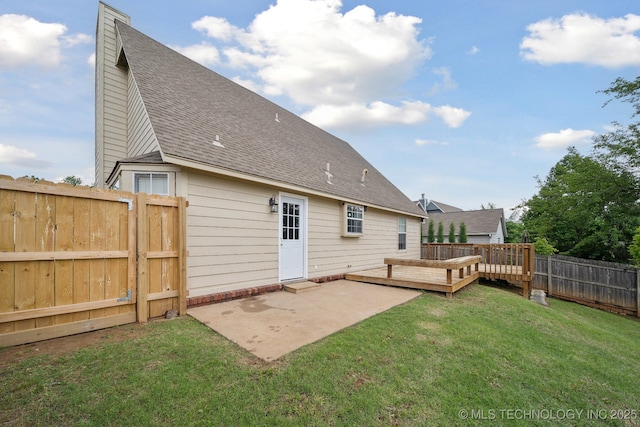 9227 S 95th E Ave, Tulsa, OK 74133 - rear view of house with roof with shingles, a chimney, a patio area, and a deck