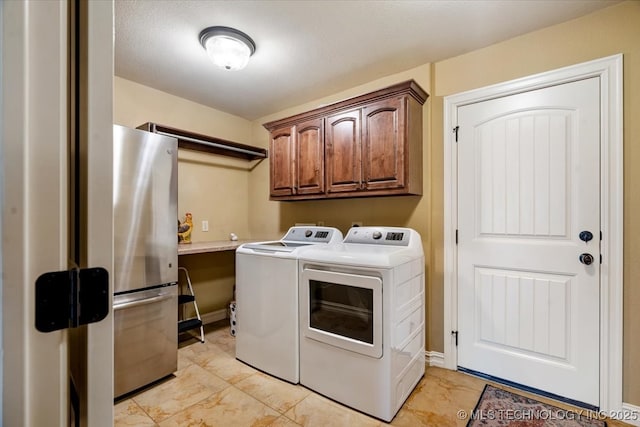 15065 N 148th Ave E, Collinsville, OK 74021 - laundry area featuring washer and dryer, cabinet space, and light marble finish floors