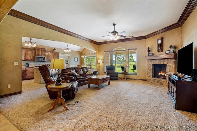 15065 N 148th Ave E, Collinsville, OK 74021 - living area with a fireplace, crown molding, a ceiling fan, arched walkways, and a chandelier