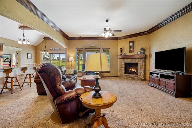 15065 N 148th Ave E, Collinsville, OK 74021 - living room with a ceiling fan, a stone fireplace, a chandelier, ornamental molding, and vaulted ceiling