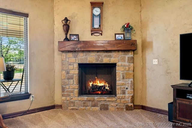 15065 N 148th Ave E, Collinsville, OK 74021 - detailed view of carpet flooring, a fireplace, baseboards, and a textured wall