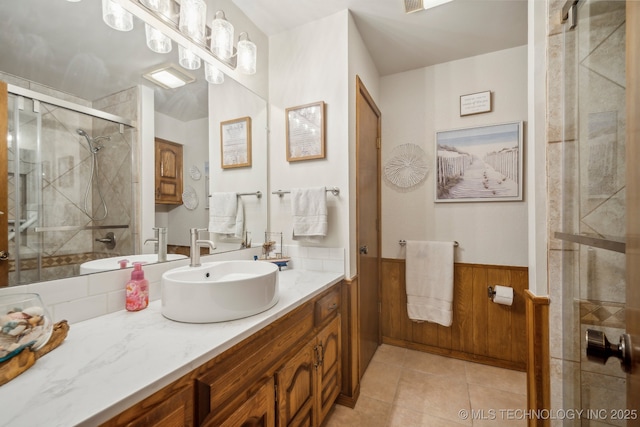2630 W Boston Pl, Broken Arrow, OK 74012 - bathroom featuring vanity, a stall shower, wainscoting, and tile patterned floors