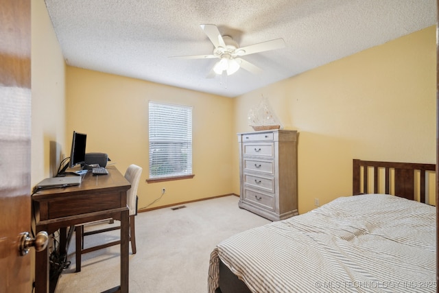 2630 W Boston Pl, Broken Arrow, OK 74012 - bedroom with light colored carpet, an office area, a textured ceiling, a ceiling fan, and baseboards