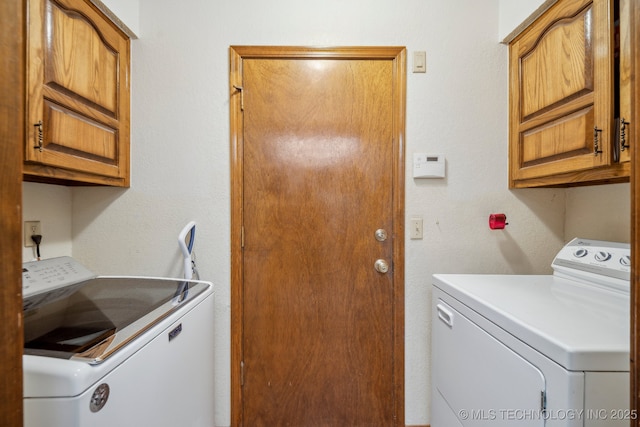 2630 W Boston Pl, Broken Arrow, OK 74012 - laundry area featuring washing machine and clothes dryer and cabinet space