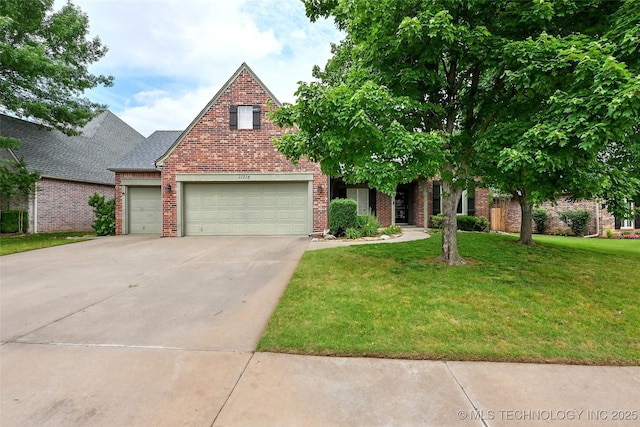 11715 S 93rd E Ave, Bixby, OK 74008 - view of front facade with brick siding, a front lawn, driveway, and a garage