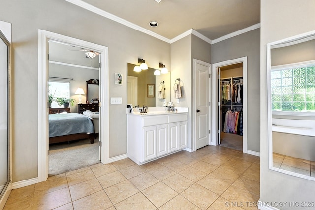 11715 S 93rd E Ave, Bixby, OK 74008 - ensuite bathroom with ornamental molding, double vanity, tile patterned floors, a spacious closet, and ceiling fan