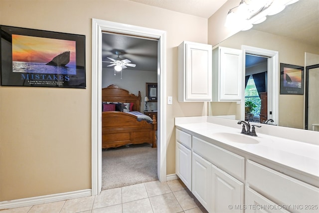 11715 S 93rd E Ave, Bixby, OK 74008 - bathroom with vanity, ensuite bathroom, tile patterned flooring, and a ceiling fan