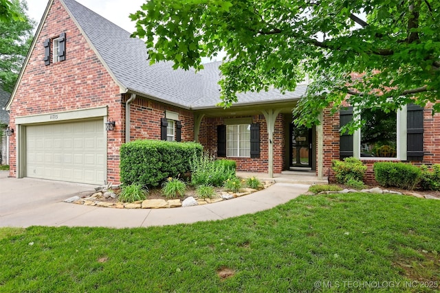 11715 S 93rd E Ave, Bixby, OK 74008 - view of front of property featuring roof with shingles, a garage, a front lawn, brick siding, and driveway
