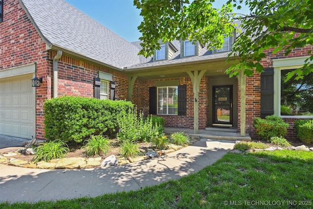 11715 S 93rd E Ave, Bixby, OK 74008 - property entrance featuring brick siding, a shingled roof, covered porch, and an attached garage