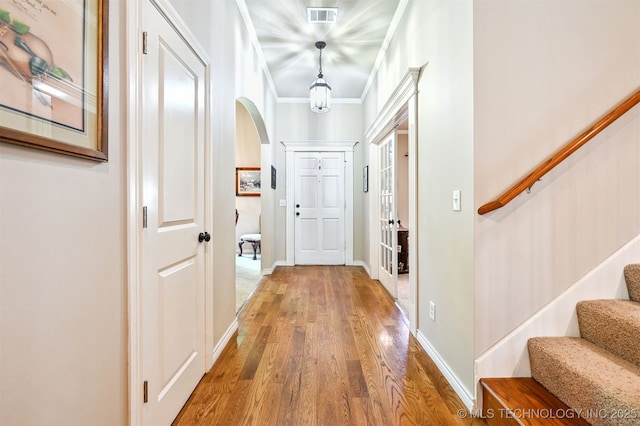 11715 S 93rd E Ave, Bixby, OK 74008 - corridor with arched walkways, wood finished floors, stairway, and crown molding