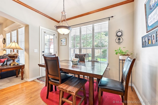 11715 S 93rd E Ave, Bixby, OK 74008 - dining room with plenty of natural light, light wood-style floors, and ornamental molding