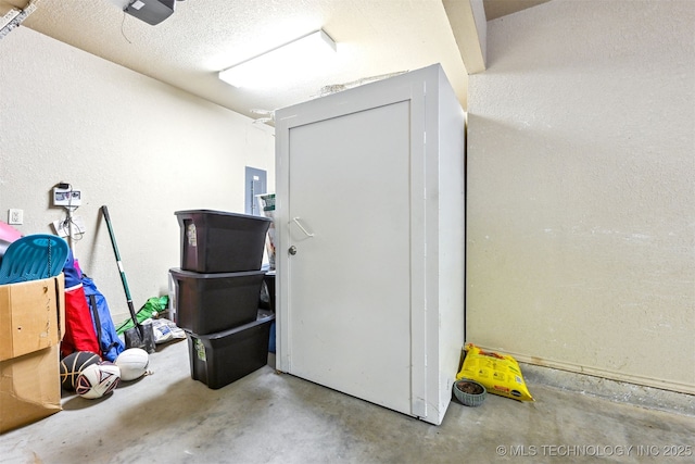 11715 S 93rd E Ave, Bixby, OK 74008 - garage with a garage door opener, a textured wall, and electric panel