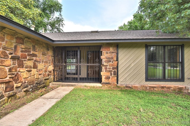 134 Spunky Creek Dr, Catoosa, OK 74015 - doorway to property with stone siding, a yard, and roof with shingles