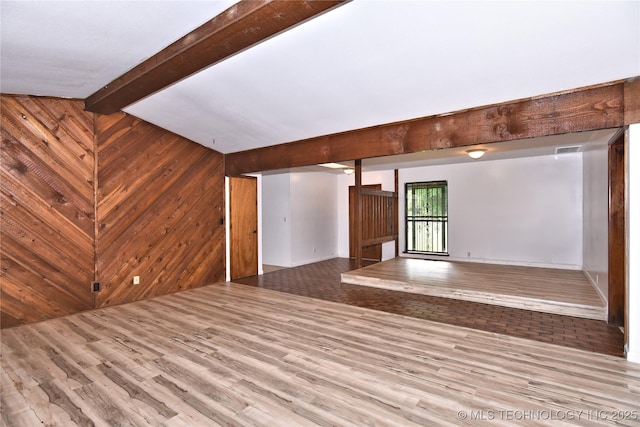 134 Spunky Creek Dr, Catoosa, OK 74015 - unfurnished living room with wood finished floors and wood walls