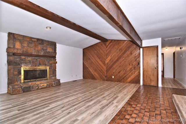 134 Spunky Creek Dr, Catoosa, OK 74015 - unfurnished living room featuring a fireplace and wooden walls