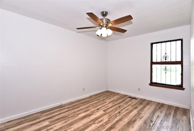 134 Spunky Creek Dr, Catoosa, OK 74015 - spare room with wood finished floors, baseboards, and a ceiling fan